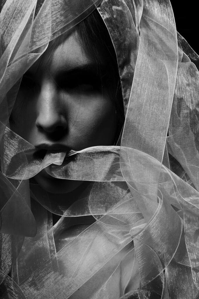 pexels-photo-458509 Monochrome portrait of a young woman with a veil, creating a mysterious atmosphere.